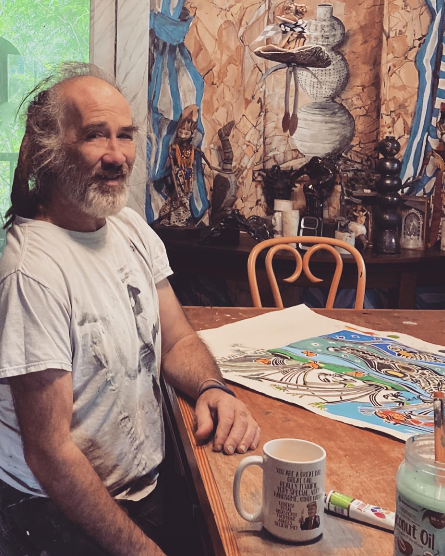 A featured ArtWalk visual artist at work in his studio