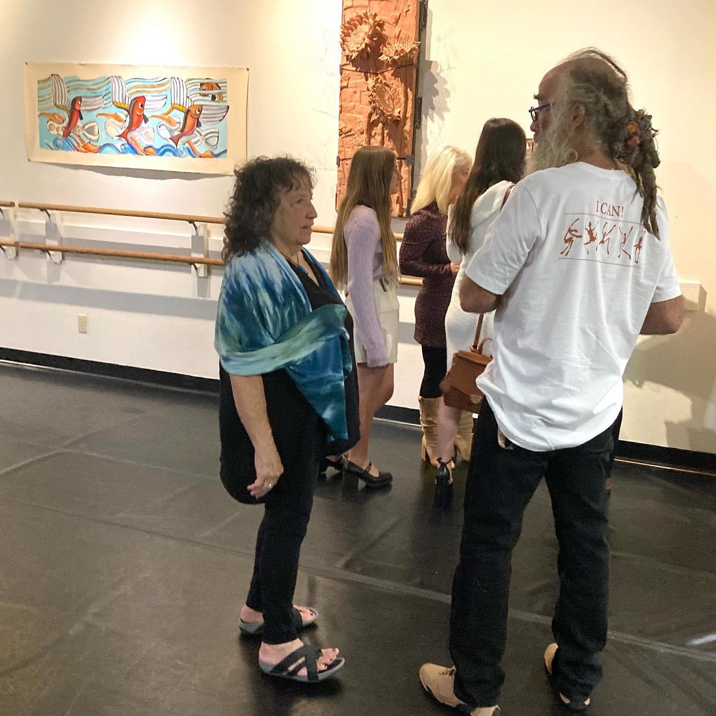 Patrons viewing artwork during an ArtWalk gallery reception